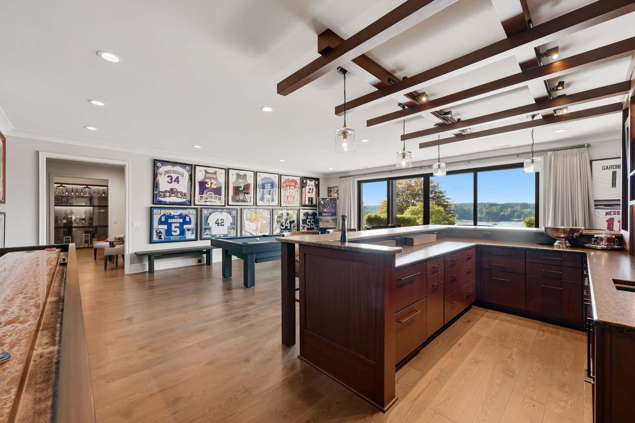 The bar seen wide, the games room and the lake behind it.