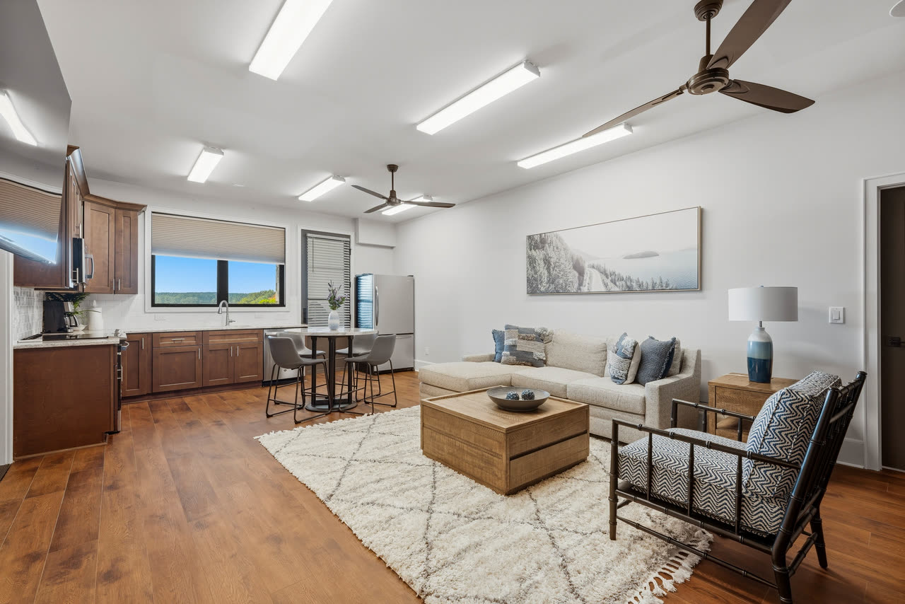 The guest apartment, a sitting room open to its own kitchen.
